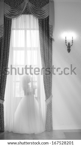 Bride at the window at the wedding