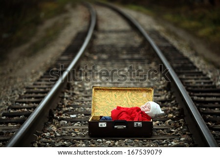 foundling, a small child in a suitcase