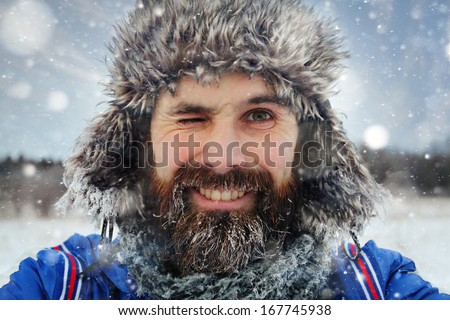 Bearded Man In Winter Hat Smiling Portrait Extreme