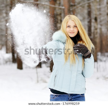 Winter fitness snowballs woman portrait