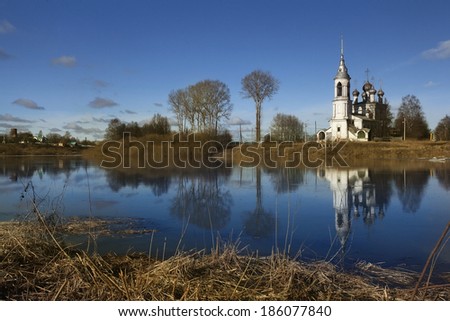 Spring flood church on the bank