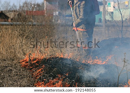 Sokol, RUSSIA - May 4: fire man on forest fire in Sokol on May 4, 2014, in Sokol, Russia