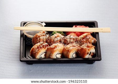 delivery service Japanese food rolls in plastic box