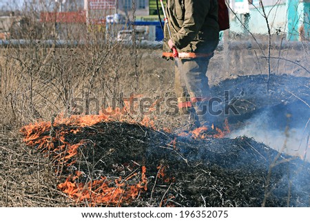 Sokol, RUSSIA - May 4: fire man on forest fire in Sokol on May 4, 2014, in Sokol, Russia