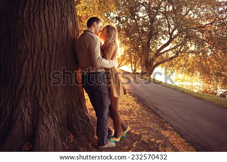 summer evening in love couple in the park sunbeams happiness