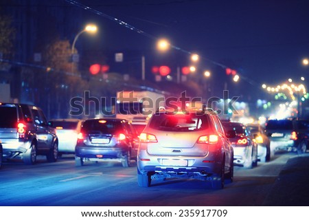 Night road in the city of lights cars traffic jams