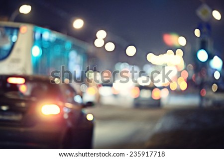 Night road in the city of lights cars traffic jams
