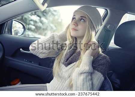 beautiful young blond teen in the car
