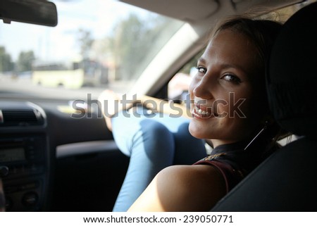 girl in the car on the passenger seat