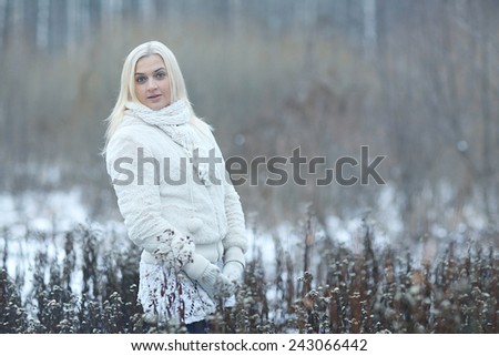 sad girl in a snowy forest