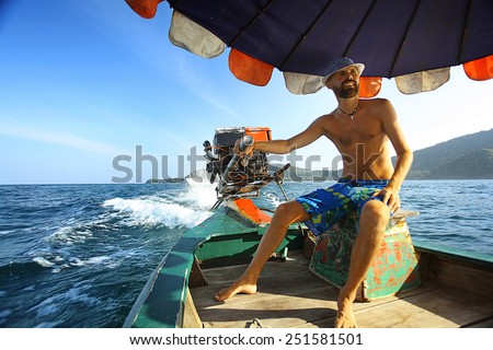 tanned man on the boat thailand vacation