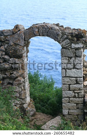 stone arch ancient ruins sea