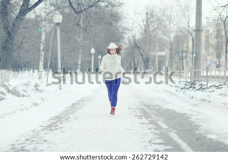 sports running girl in winter sweater