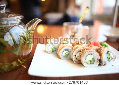decorated table with food and drinks in a restaurant background