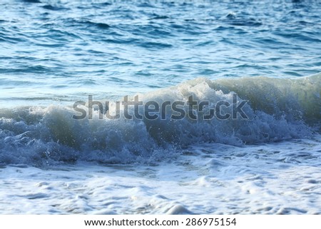 sea wave coast surf foam blue background