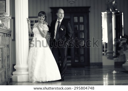 bride and groom wedding black and white portrait indoors