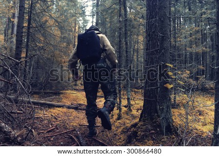 ranger in autumn forest forester guide