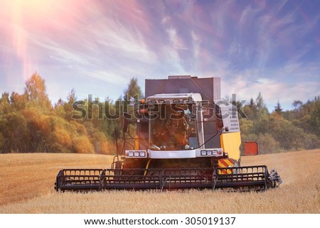 tractor in a field to harvest