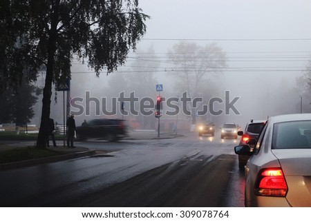 blurred background autumn fog on city road
