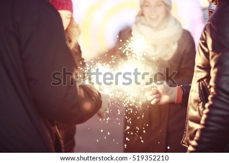 youth celebrating the New Year & holiday on a city street
