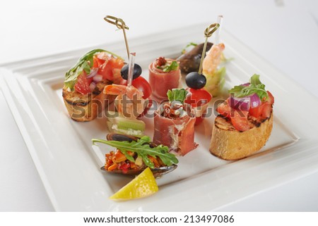 Gourmet Appetizing Variety Food on Square Plate, Isolated White Background
