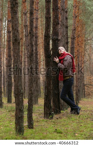 Young alone women in pine forest