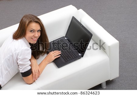 young woman with laptop. smiling face