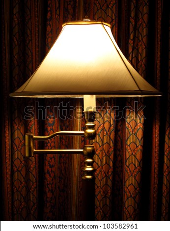 stand lamp and red curtain in the room