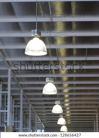 Lamp in hall of warehouse.