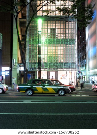 TOKYO, JAPAN- AUGUST 21, 2013: Taxi in Ginza area, that serving passenger in commercial district, upmarket shopping, dining and entertainment. Tokyo, Japan. August 21 2013