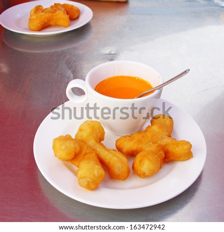 Chinese deep-fried dough sticks and  Ceylon\'s tea.