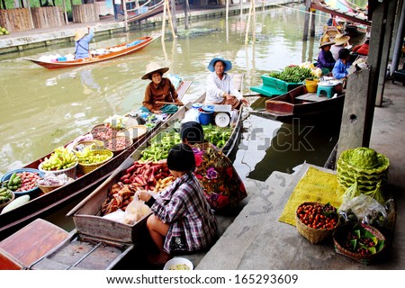 AMPHAWA,THAILAND-NOVEMBER 17,2013:Thaka Floating Market is a market place along the canal that meet with boat vendors selling their wares and partake in Samut Songkhram,Thailand.November 17 2013