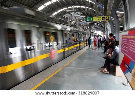 NEW DELHI, INDIA - JULY 20, 2015: Traveler waiting for train in metro station. Delhi, India. JULY 20 2015