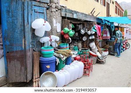 LEH LADAKH, INDIA - JULY 26, 2015: Unidentified people buy something at appliance shop in Leh market, Ladakh, India . JULY 26 2015