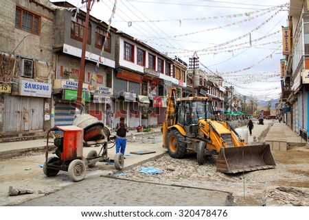 LEH LADAKH, INDIA - JULY 22, 2015: Wheel loader parking in construction site of Main Barza road improvement project, Leh,  Jammu and Kashmir, India. JULY 22 2015