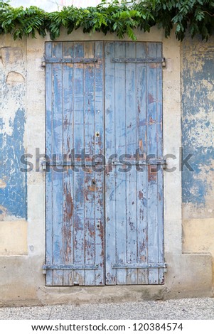Old blue painted door, weathered. France, Provence