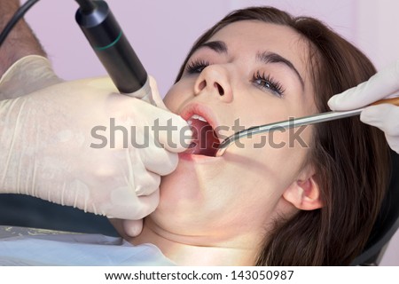 Close up of woman\'s mouth at dentist. Close up of woman\'s mouth at dentist having oral surgery