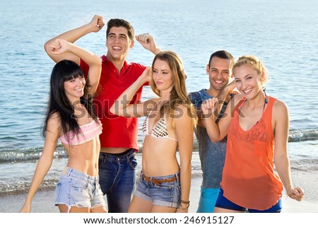 Young Friends in Summer Outfits Enjoying at the Beach on During Summer Season.