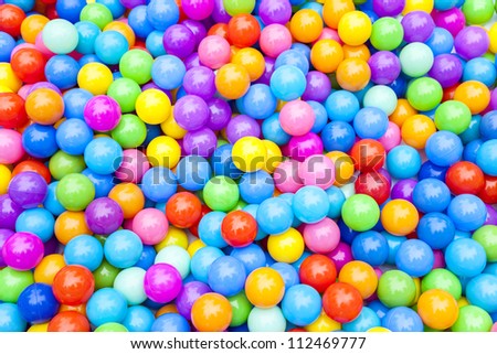 Hundreds of colorful plastic multi-colored balls