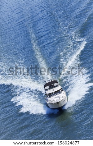 Aerial photograph of luxury power boat yacht speedboat on blue sea