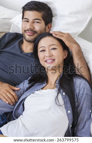 Asian Chinese man woman romantic couple laying back relaxing