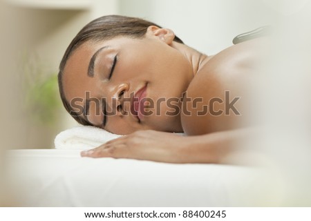 Lifestyle - Pagina 3 Stock-photo-an-african-american-woman-relaxing-at-a-health-spa-while-having-a-hot-stone-treatment-or-massage-88400245