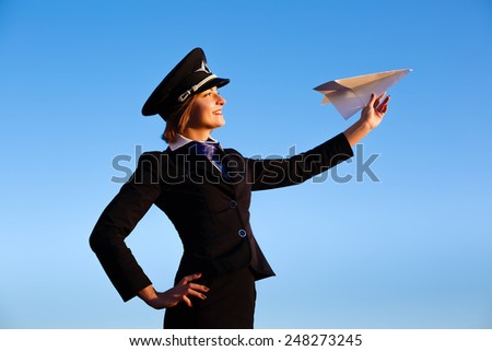 Beautiful young woman stewardess in shape