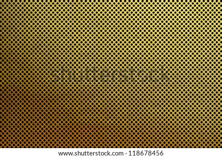 Gold metal plate with many small circular holes