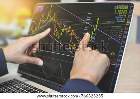 top view of business people working with stock trading forex with technical indicator tool on laptop