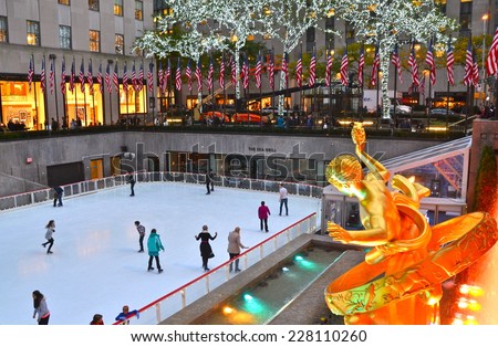 NEW YORK CITY - NOVEMBER 3, 2014: Rockefeller Center Ice skaters and tourists are all around the famous Rockefeller Center on November 3, 2014 in Manhattan, New York City, USA..