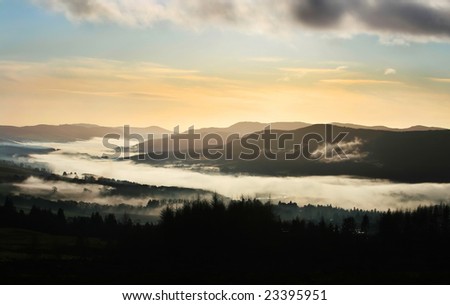 Morning fog flows down the Tay Valley