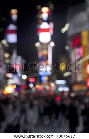 Times Square lights at night/Times Square at Night/Blurred image of Times Square lights, traffic and pedestrians at night