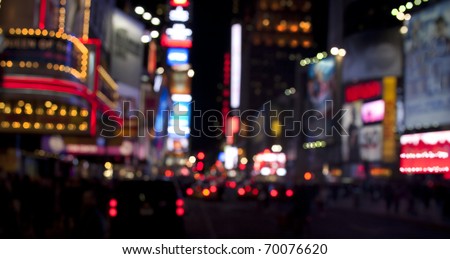Times Square lights at night/Times Square at Night/Blurred image of Times Square traffic, lights and pedestrians at night