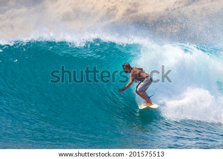 Surfing a Wave Lombok Island Indonesia Surfing a Wave Lombok Island Indonesia